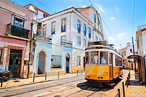 Famous vintage tram in the street of Alfama, Lisbon, Portugal