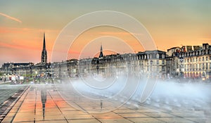 Famous water mirror fountain in front of Place de la Bourse in Bordeaux, France