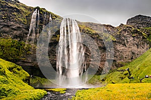 Famous waterfall of a cliff in Iceland. Seljalandsfoss Waterfall