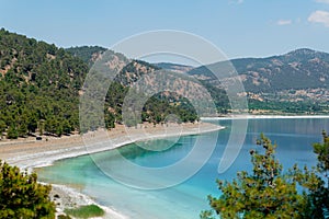 Famous white-colored lake Salda beach and the hills in background, Burdur, Turkey