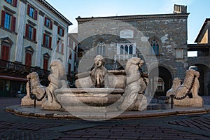 Famous white marble Contarini Fountain in the middle of Piazza Vecchia square in Bergamo Upper Town photo