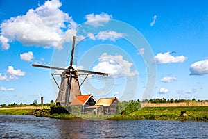 Famous windmills in Kinderdijk village in Holland. Colorful spring rural landscape in Netherlands, Europe. UNESCO World Heritage