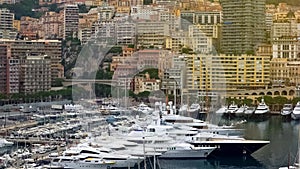 Famous yacht club in Monaco, many expensive boats moored in harbor, luxury life