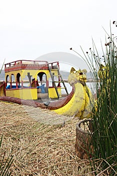 The famous yellow boats made of reeds by the native indians of Lake Titicaca in Peru, South america