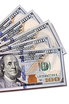Fan of US dollar $100 bills isolated on white background