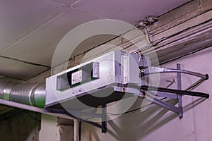 Fan coil with connected water pipes and flexible air duct