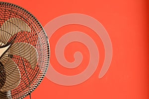 Fan, device with a non-functioning helix turned off, part of a fan, with grids and brick background painted in red, Brazil, South
