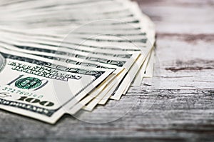 A fan of 100 dollar bills