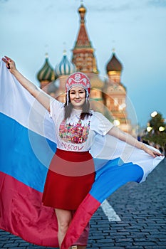 Fan of FIFA kokoshnike with Russian flag on red square in Moscow