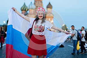 Fan of FIFA kokoshnike with Russian flag on red square in Moscow