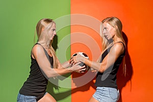 Fan sport woman player holding soccer ball