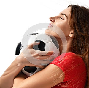 Fan sport woman player in red uniform hold soccer ball celebrating happy up with free text copy space