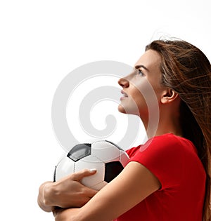 Fan sport woman player in red uniform hold soccer ball celebrating happy up with free text copy space