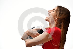 Fan sport woman player in red uniform hold soccer ball celebrating screaming happy up with free text copy space