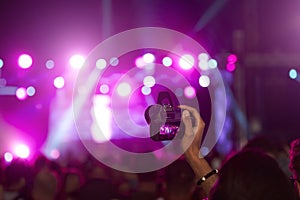 Fan Taking Photo On Camera At Music Festival