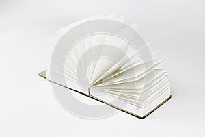 Fan unfold open small notepad with blank light beige pages. Notebook, sketchbook. White. Minimalism