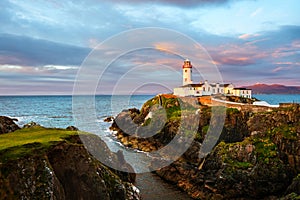 Fanad head at Donegal, Ireland with lighthouse at sunset photo