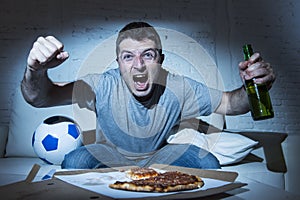 Fanatic crazy football fan watching television soccer screaming happy celebrating scoring goal