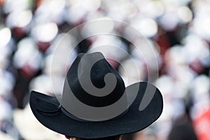 Fancy Black Cowboy hat in focus at the rodeo