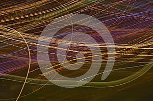 Fancy, colourful neon signs - abstract background with irregular   light lines. photo