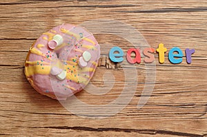 A fancy decorated doughnut with the word easter