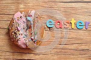 A fancy decorated doughnut with the word easter