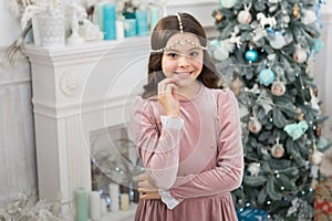 Fancy girl in luxury decorated interior. Happy childhood. Waiting christmas. Glamorous girl celebrate christmas. Host