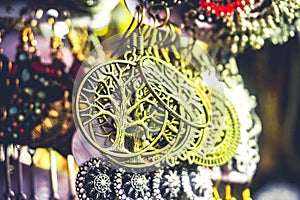 Fancy hanging earings with the symbol of the tree