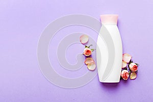 Fancy healthcare bottles for cream with rose flower. Natural oranic spa cosmetics concept. Mockup, template, Top view