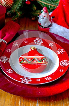 Fancy Christmas plate setting with pretty sugar cookie