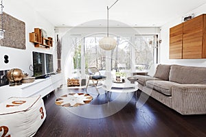 Fancy living room with large window and dark wooden floor