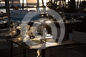 Fancy outdoor restaurant table setting at sunset