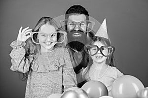 Fancy party. Family of father and daughters wearing party goggles. Family party. Happy family celebrating birthday party