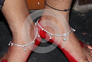 Fancy silver payal wearing a girl , indian traditional anklet foot chain with white colour