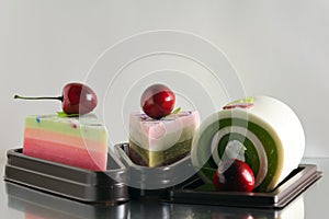 Fancy soap in cake form with cherry(Selective focus on cherry)
