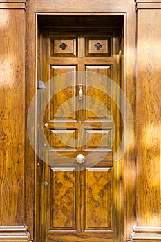 Fancy solid wooden front door with vintage look and brass door k