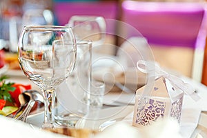 Fancy table set for dinner with napkin glasses in restaurant, luxury interior background. Wedding elegant banquet