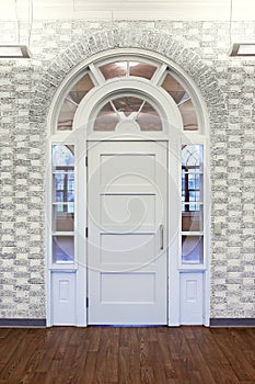 Fancy White Ornate Doorway with Arched Window Woodwork in Old Building