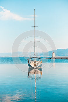 Fancy yacht moored in the harbor of a small town Postira - Croatia, island Brac