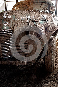 fangio museum in the city of barcarce argentina, shows an old race car from the year 1950 with mud on the roads of the race