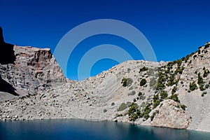 Fann mountains blue lake. Dry mountains landscape