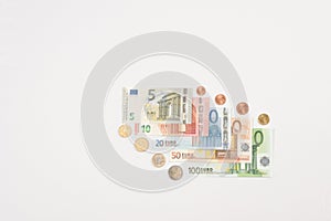 Fanned Euro notes and coins