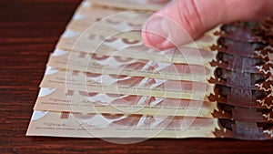 Fanned Pile of Hundred Dollar Banknotes on a Table