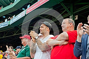 Fans cheer at a Red Sox game