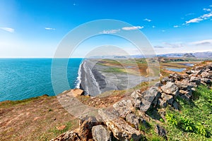 Fantasic view of Kirkjufjara black sand beach from Dyrholaey promontory on Atlantic South Coast