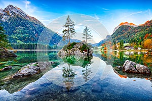 Fantastic autumn sunrise of Hintersee lake. Classic postcard vie