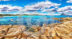 Fantastic azure water with rocks near beach Porto Taverna photo