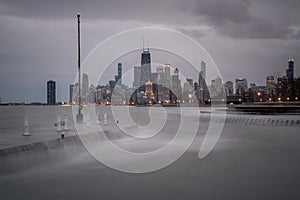 Fantastic cityscape panoramic skyline view of Chicago from Fullerton Avenue during a windy day with water cascading over a