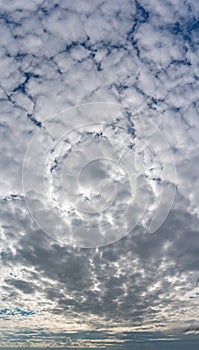 Fantastic clouds against blue sky, panorama