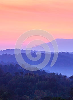 Fantastic clouds and sky at sunrise. Cloudscape. Colorful scenic tropical forest and mountains in winter season. Tropical